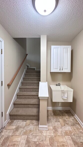 Stairs to bonus room - 145 White Dogwood Ln