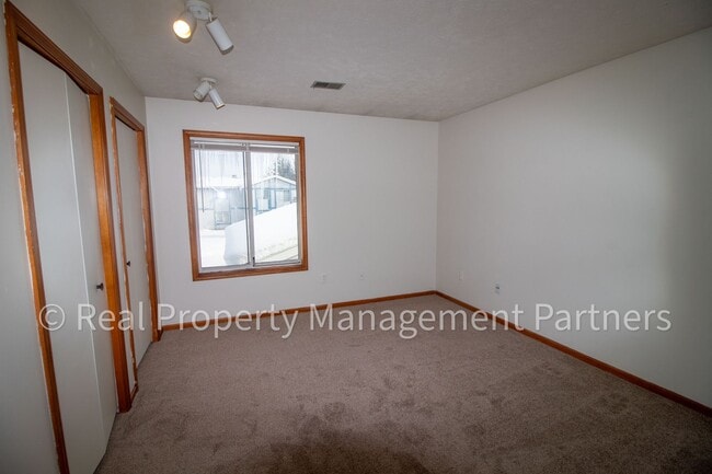 Building Photo - 2-Bed, 1-Bath Upper Unit with Garage & Porch – Steps from Paul Henry Trail