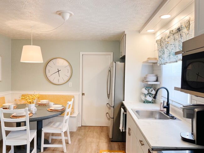 Comfy bench in the kitchen. - 2802 Linden Ave