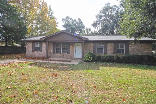 Building Photo - Spacious 3BR/1.5BA Home in Pace with Open Living Area, Tiled Family Room, and Fenced Backyard – M...