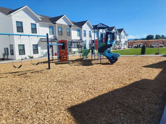 Building Photo - BEAUTIFUL 4 BEDROOM TOWNHOME for rent in Ammon w/ 2 Car Garage! Deposit-Free Lease option for qua...