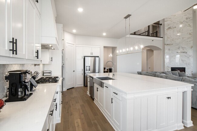 Building Photo - Stunning 4-Bedroom Luxury Residence with Bonus Office in the Prestigious Walsh Community LIKE NEW!