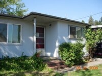 Building Photo - 3 Bedroom 2 Bathroom with 2 car Carport in...