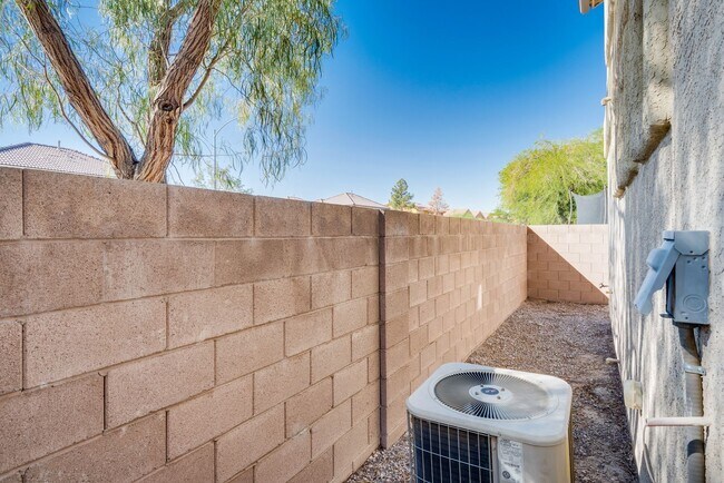 Building Photo - Very nice kept two-story 3 bedroom 2 bath house in a small gated community on the east side