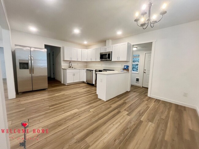 Building Photo - 4 bedroom home with air conditioning - Great location!!!  HUGE basement for your man cave or she ...