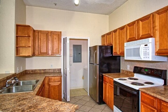 Building Photo - Private, updated, 2/2, 3rd-floor condo, wi...