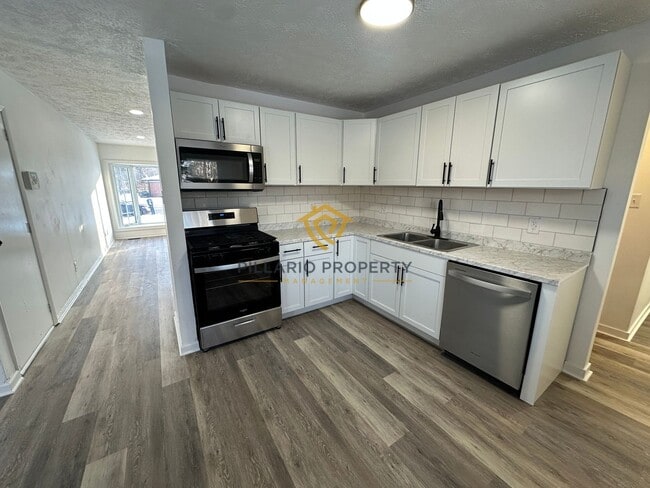 Building Photo - Spacious & Updated 4BR/2BA Home Near Holliday Park — Move-In Ready!