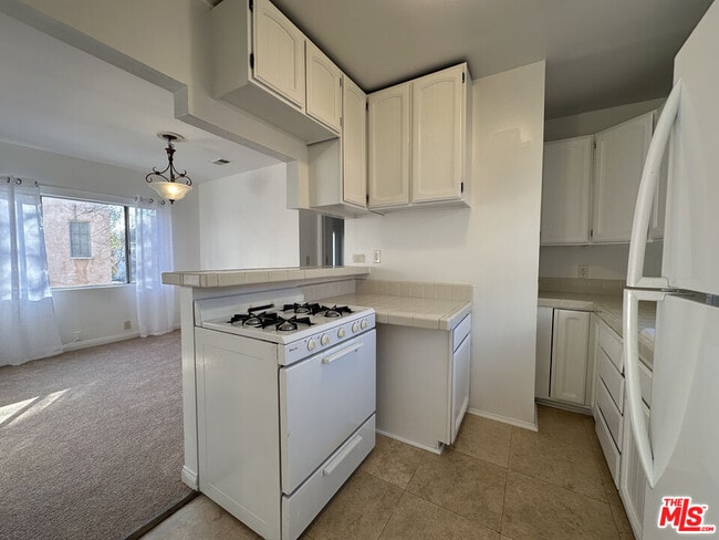 Building Photo - 6069 1/2 Cashio St