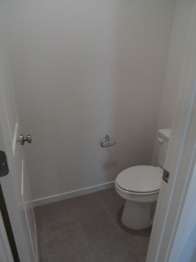 Building Photo - 4BR 3BA two-story condo with 2 Car Attache...