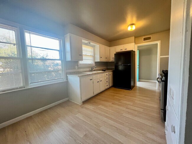 Building Photo - PRE-LEASING FOR JULY! Great 3/2/1 with Two Living Areas