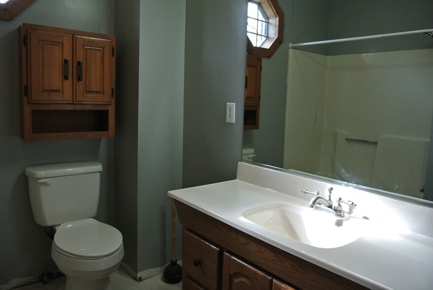 Large 48" vanity with storage cabinets in bathroom. - 1104 West Taylor Street
