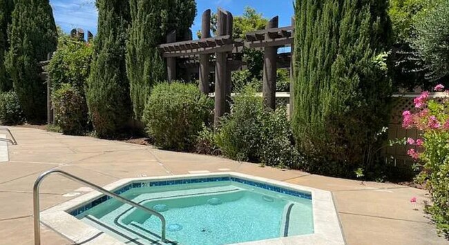 Building Photo - Available Now is a Beautiful Condo Located...