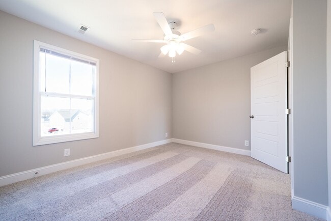 Building Photo - Elegant Home with Stone Fireplace, Kitchen Island and Designer Primary Suite