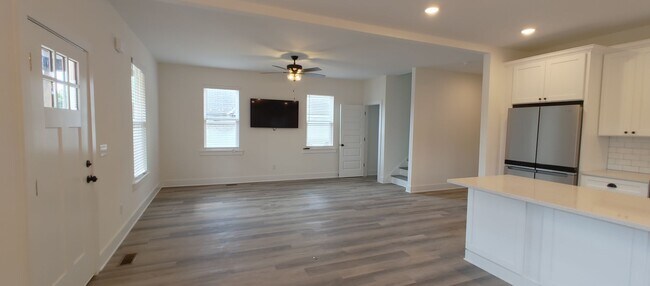 Building Photo - 5-bedroom home with 3 car garage and fully...