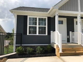 Large windows with plantation blinds offering abundant light, manicured beds - 2312-A Belle Ave NE