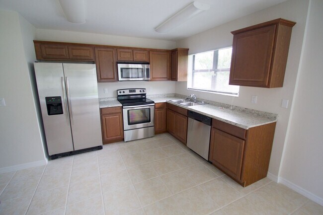 Building Photo - Waterfront 3BR Home on Canal | Spacious Yard | Lawn Care Included | Pet Friendly