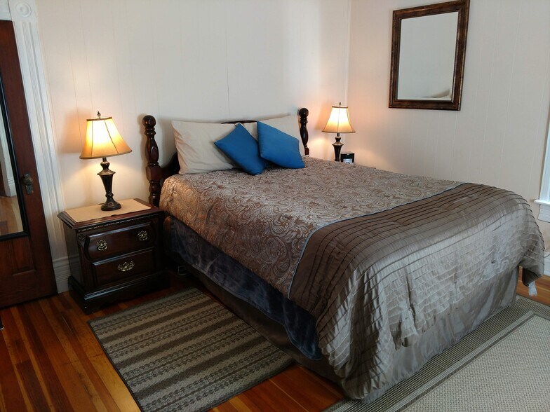 Front bedroom - shown with queen size bed (furnishings not included with rental) - 607 Harrison Ave