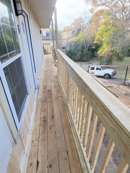 Relax and enjoy the outdoors on this updated porch. - 2125 Banita St