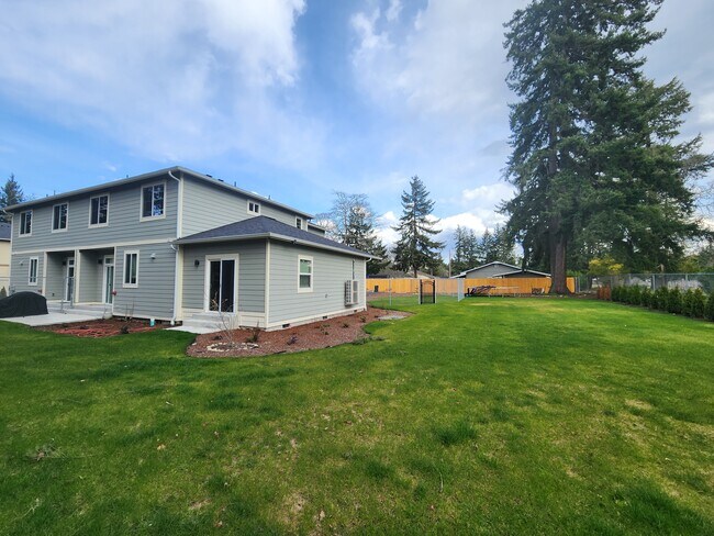 Back view (with beautiful landscape & sprinkler) - 958 152nd St E