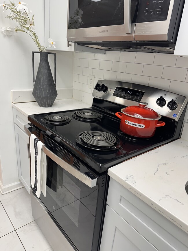 MODERN KITCHEN — Bright, updated kitchen with stainless steel appliances and a clean, contemporary f - 353 High St