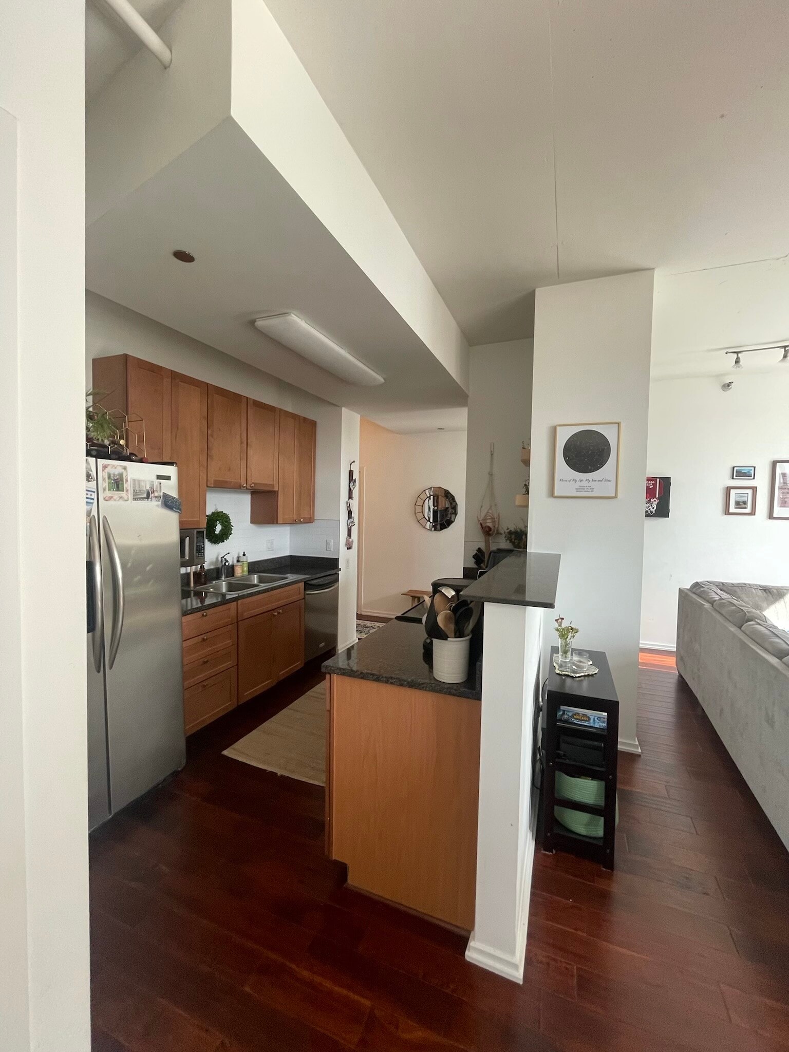 open layout with small divider between kitchen and living area - 1000 W Leland Ave