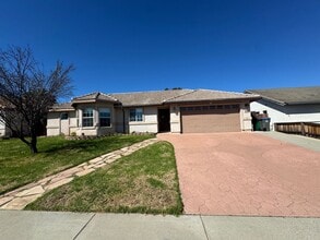 Building Photo - 4-Bedroom Home with Updated Kitchen and Co...