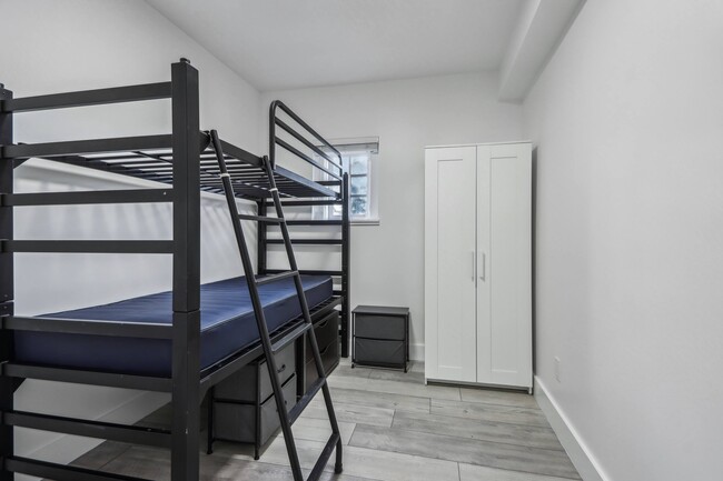 Bedroom with bunk bed and closet - 2500 Durant