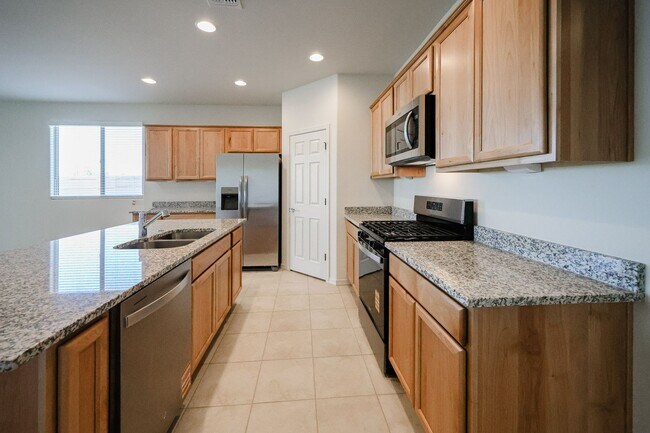 Building Photo - New 4 Bedroom + Den Home in Asante Community