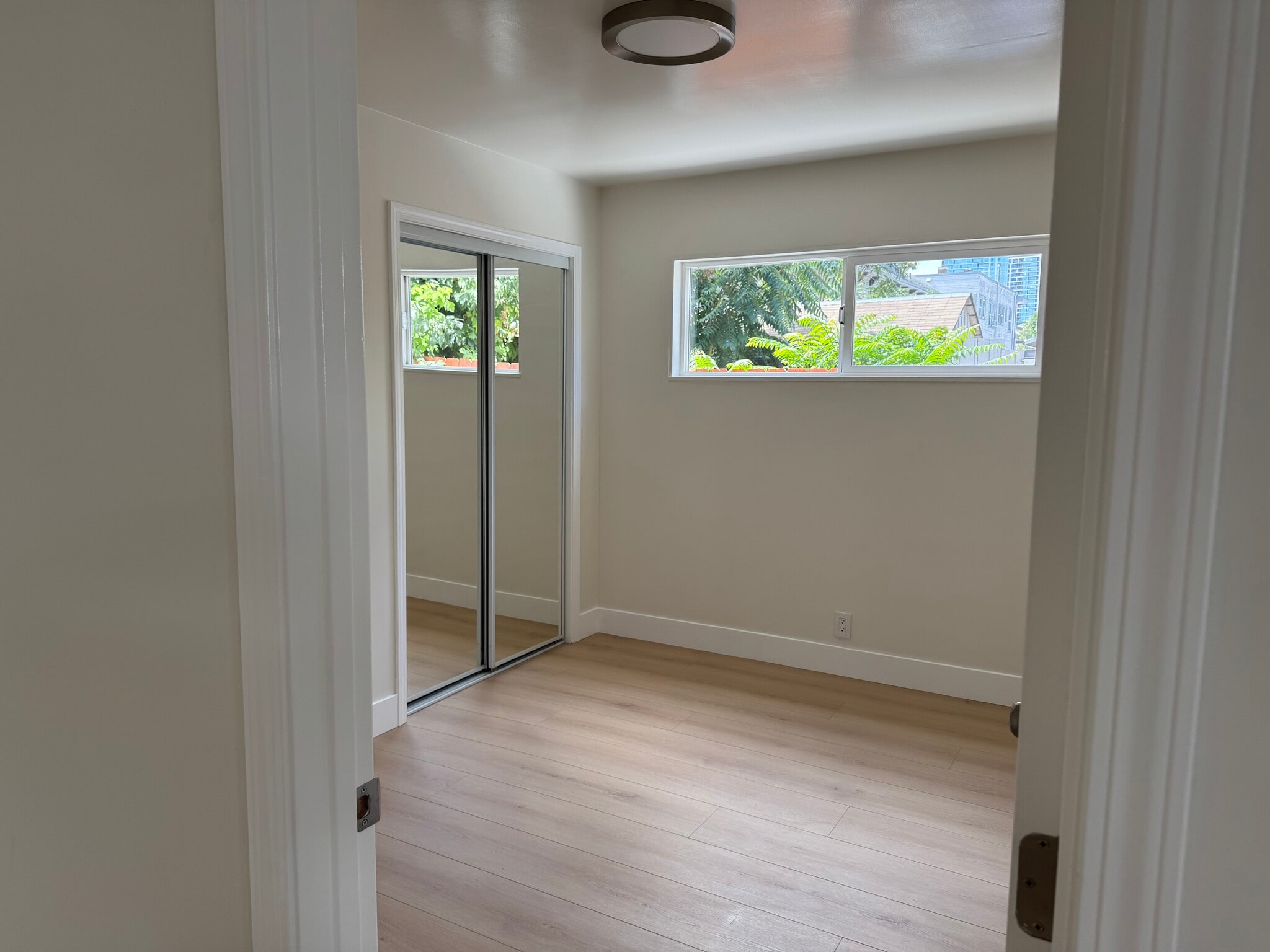 Natural lighting in the bed room with new fixtures, doors, premium floor and insulated unit. - 83 N 11th St