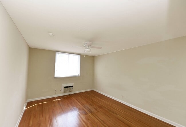 Living room with hardwood flooring - West End Living