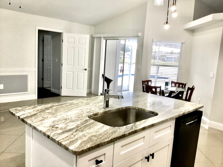 Kitchen island with granite countertop, and sink - 5714 29th Ct E