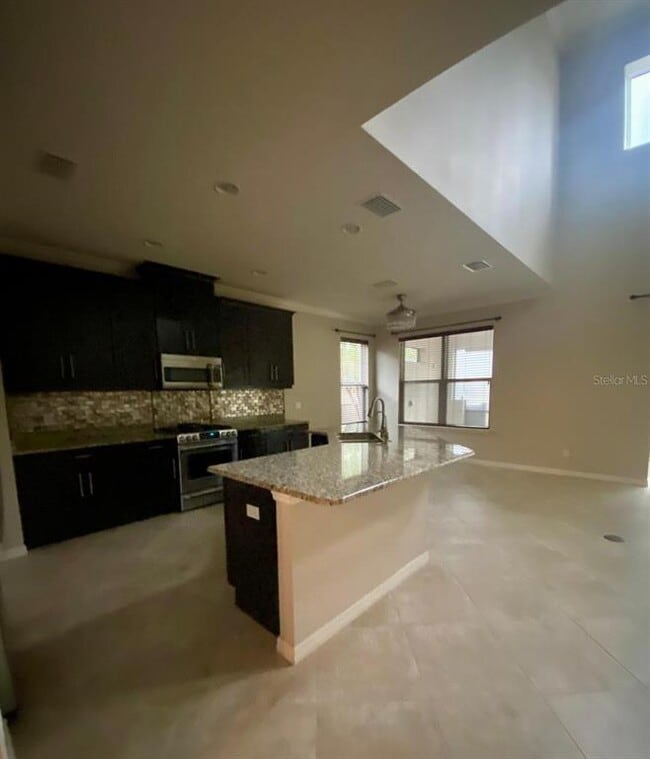 Building Photo - 8812 Tropical Palm Dr