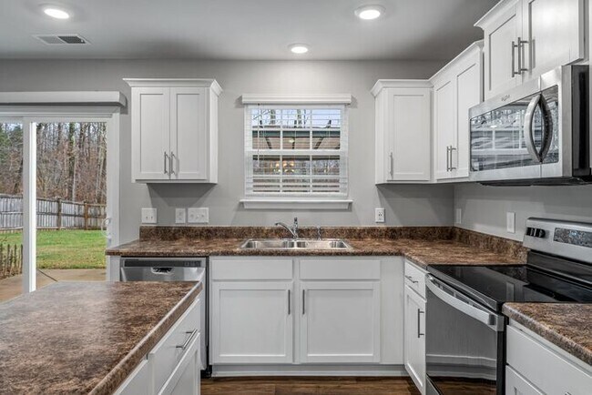 Building Photo - Newer Home in Reedy Fork, So Many Upgrades, SS Appliance, Loft, Garage, Fenced!