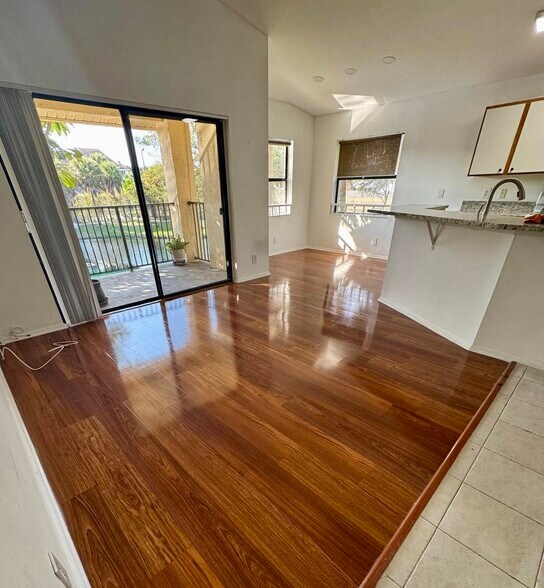 Living Room with entrance to the Balcony - 9999 Summerbreeze Dr