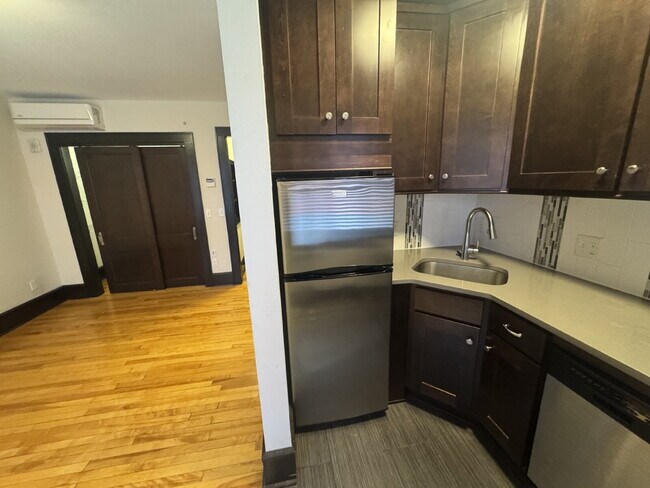 Building Photo - "Charming Studio Retreat with Hardwood Elegance in Downtown Minneapolis!"