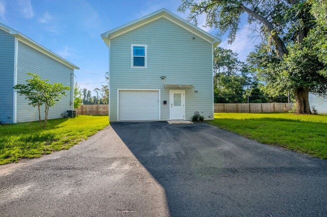 Building Photo - Modern Comfort Meets Prime Location — Stylish 2-Story Townhome