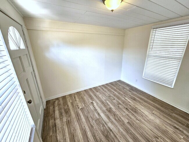 Building Photo - fully renovated 2-bedroom, 1-bathroom home with bonus guest room or office and oversized fenced yard