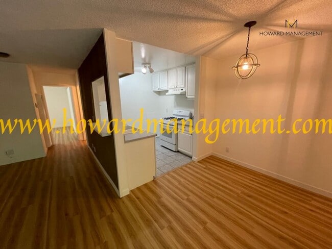 Building Photo - Bonus Den! Beautiful lower condo with large patio in Tara Hills, a resort style living complex!