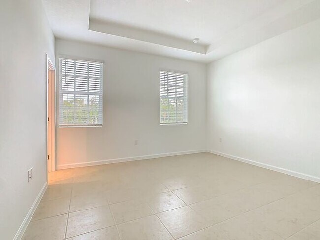 Building Photo - New Luxury Townhome in Celebration, FL Corner unit. All porcelain tiled floors. Aleutian model by...