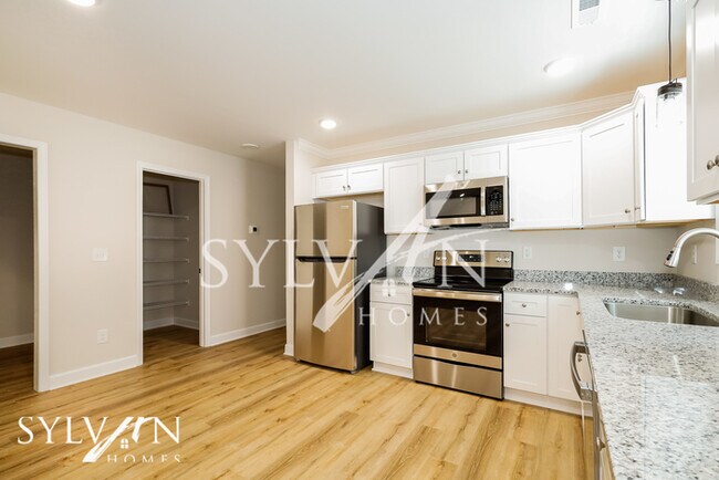 Building Photo - Lease today! No extra charge for contentme...
