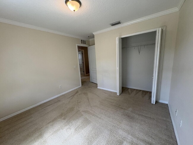 Building Photo - Spacious 5-Bedroom Pool Home with Putting ...