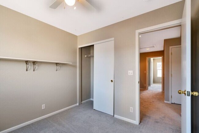 Building Photo - 3BR Townhome Near DIA & Light Rail | New Carpet, Garage & Fenced Patio