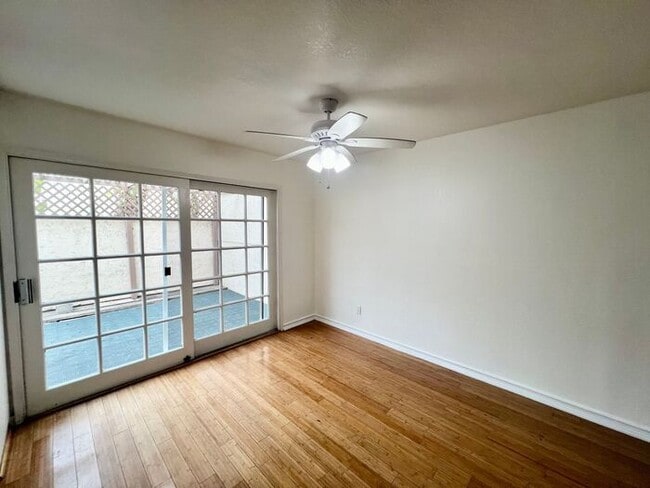 Building Photo - Stunning 4BR Townhome with Hardwood Floors, Private Patio, Community Pool & 2-Car Garage!