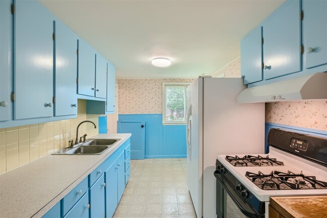 Newly painted cabinets and fun vintage wallpaper - 1708 Aspen St