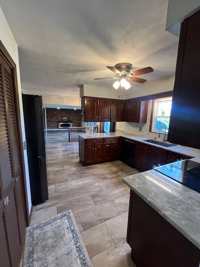 Building Photo - Spacious, Fully Updated Home with Walkout Basement on a Mature Lot