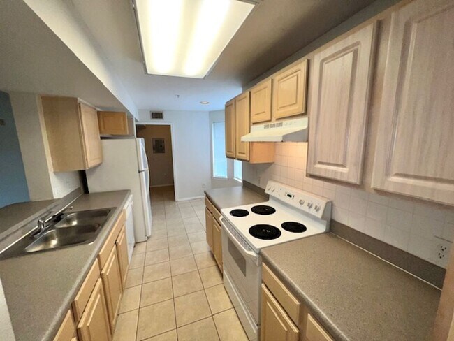 Building Photo - Move in NOW- Spacious 2 bedroom 1 bath condo on 3rd floor in gated community! Water included with...