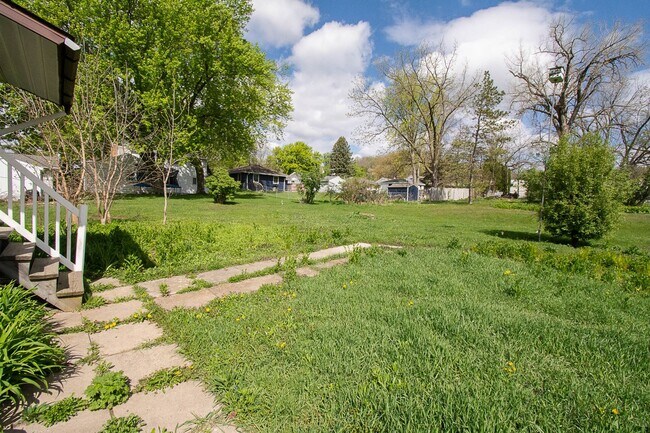 Building Photo - Bright, beautiful home with 3 garage spaces & tons of storage!