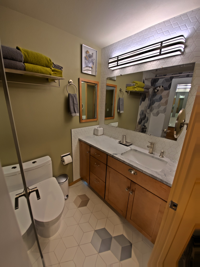 Bathroom with lighted vanity mirror - 3435 California Ave SW