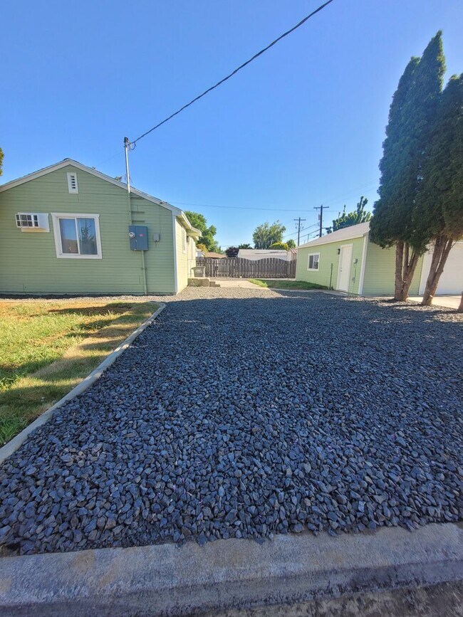 Building Photo - Free May rent with 1 Year Lease - Fully Remodeled with Garage & Yard Care Included