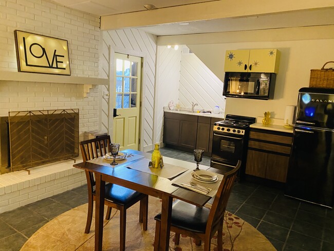 View from living area to kitchen and entry door - 1925 Charlotte Dr